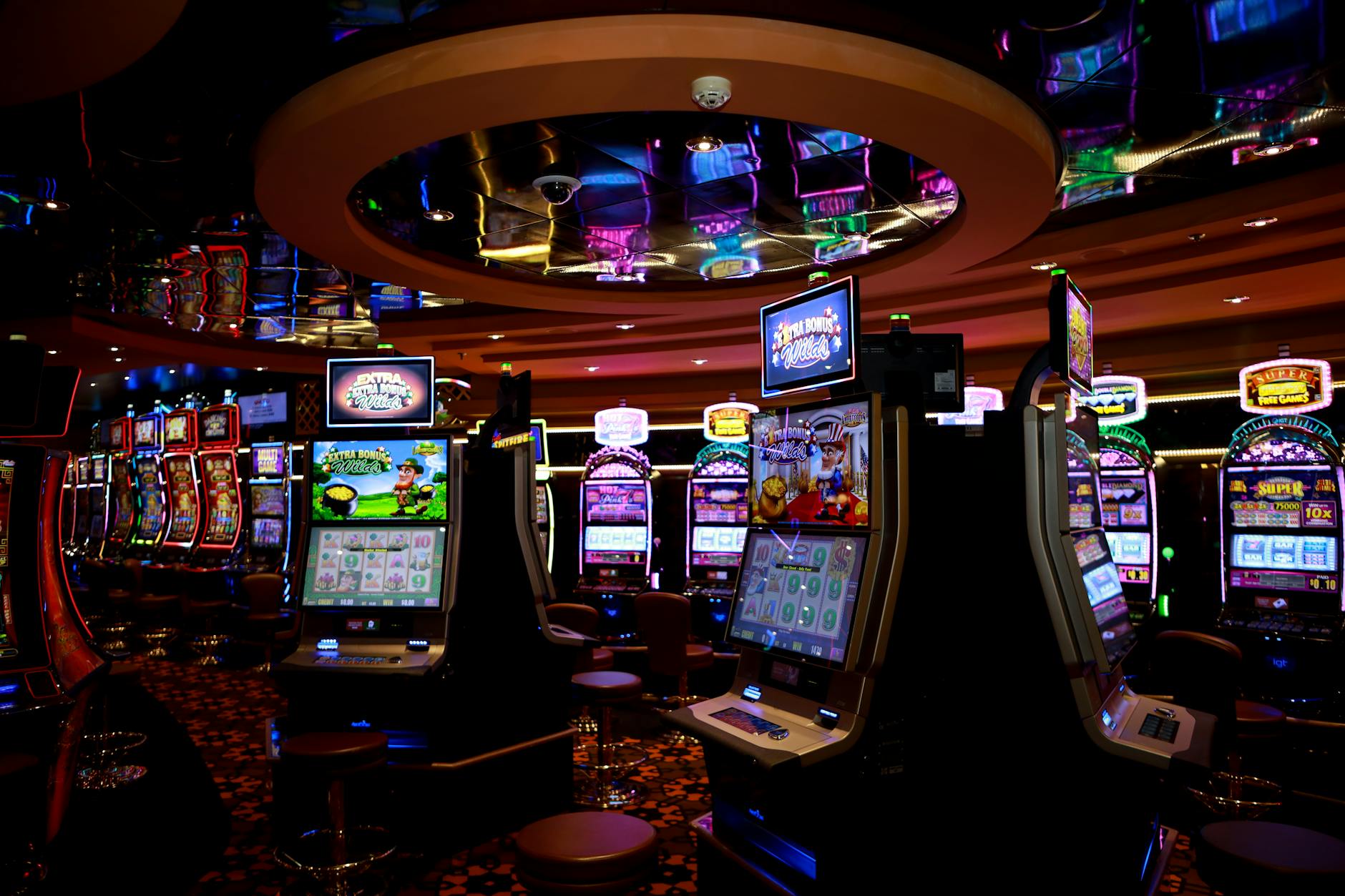 Vibrant casino floor with colorful slot machines and bright lights capturing a lively gaming atmosph