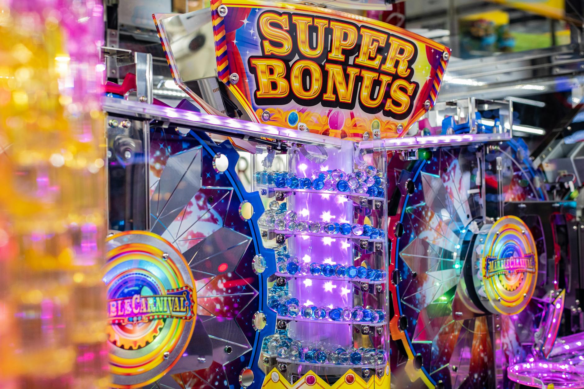Colorful neon arcade machine featuring a 'Super Bonus' display with bright lights and playful design